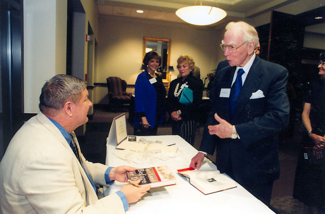 Jeff Guinn, winner of the 2003 Texas Book Award, autographing a book for Speaker Jim Wright.
