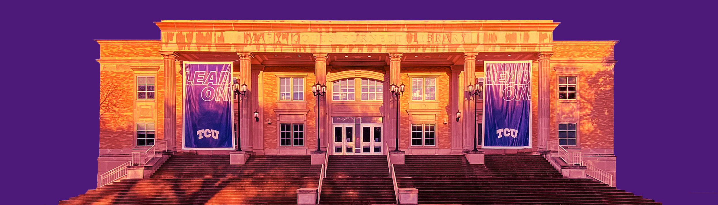 The TCU Library after rain, with a rainbow above it.