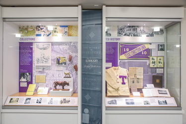 Exhibit cases. with objects, photos and text.